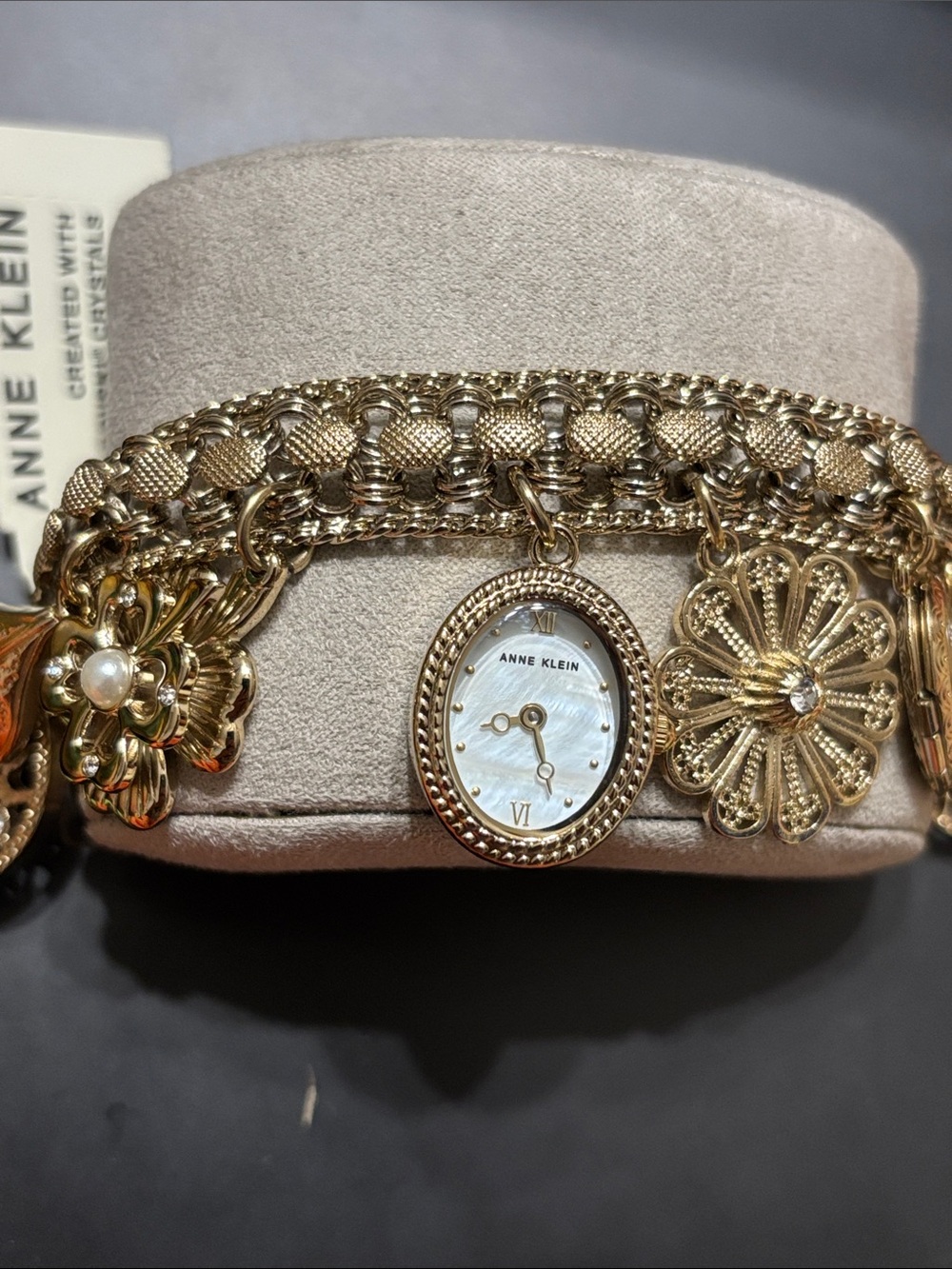 Anne Klein Gold-Tone Floral Charm Bracelet Watch with Mother-of-Pearl Dial